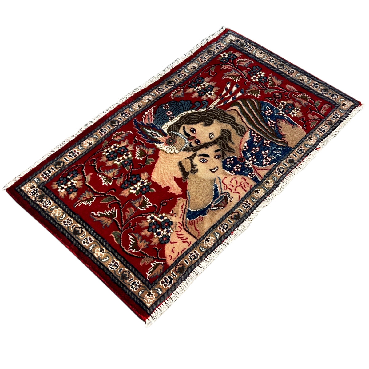 Red patterned rug with fringes and an ornamental figurative design