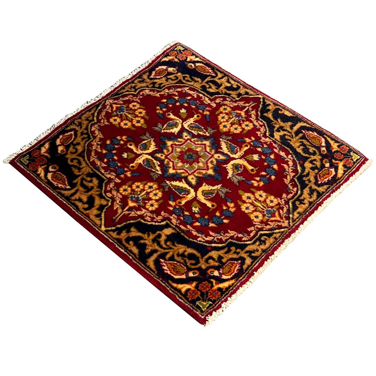 Square rug with a twisted look: red center, blue-and-gold ornaments, fringe