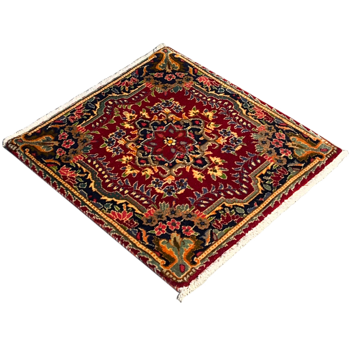 Red carpet with a detailed ornamental pattern, colorful border, and square selvedge