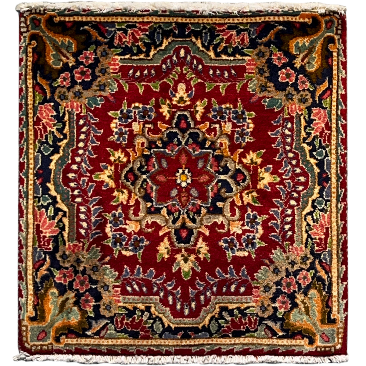 Square red rug with a multicolored ornamental pattern and a wide decorative border