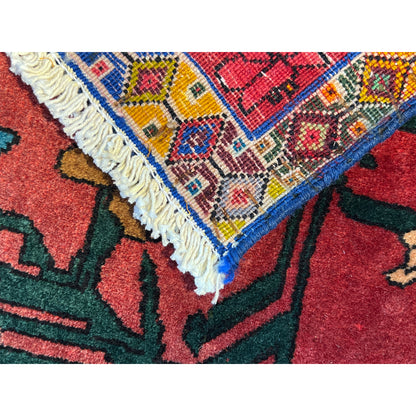 Close-up of the carpet edge: fringe trim and multicolored pattern in the border area