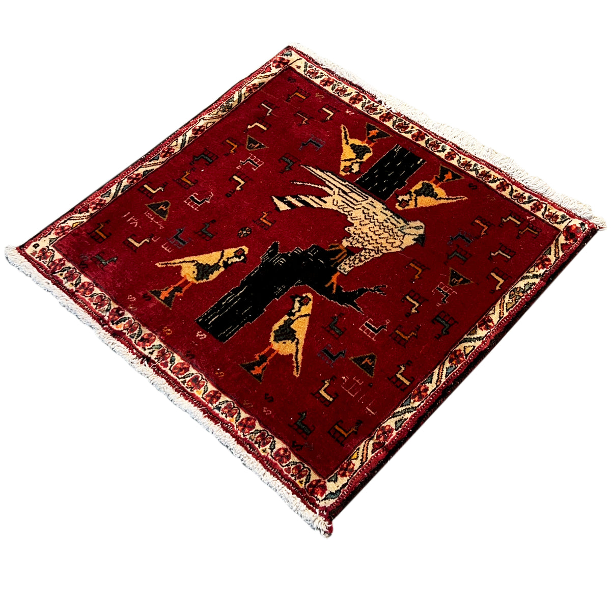 Red Poshti rug (65x62 cm) laid out, detailed animal image in the center