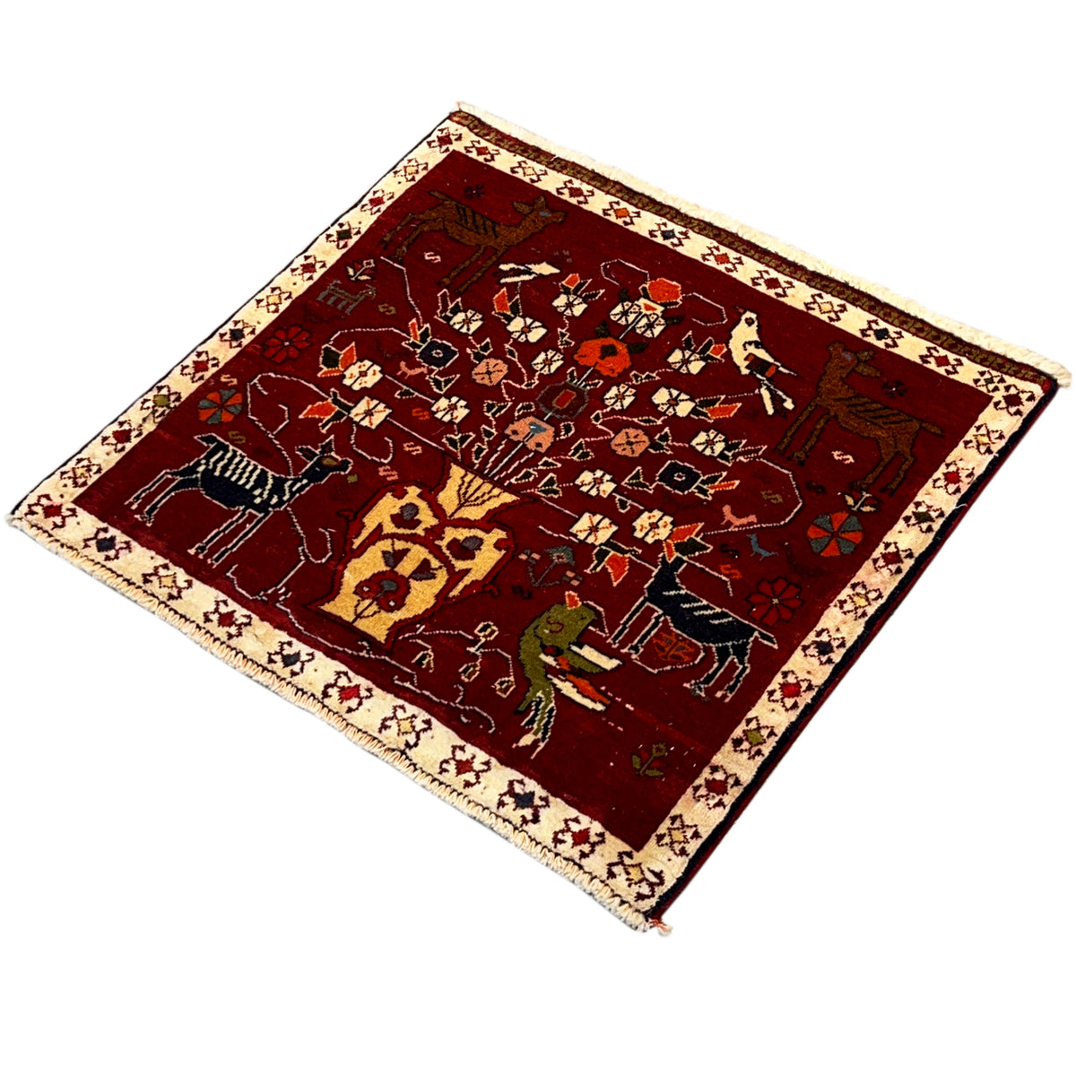Red Poshti rug in angled view with moderately rich ornamentation, beige border