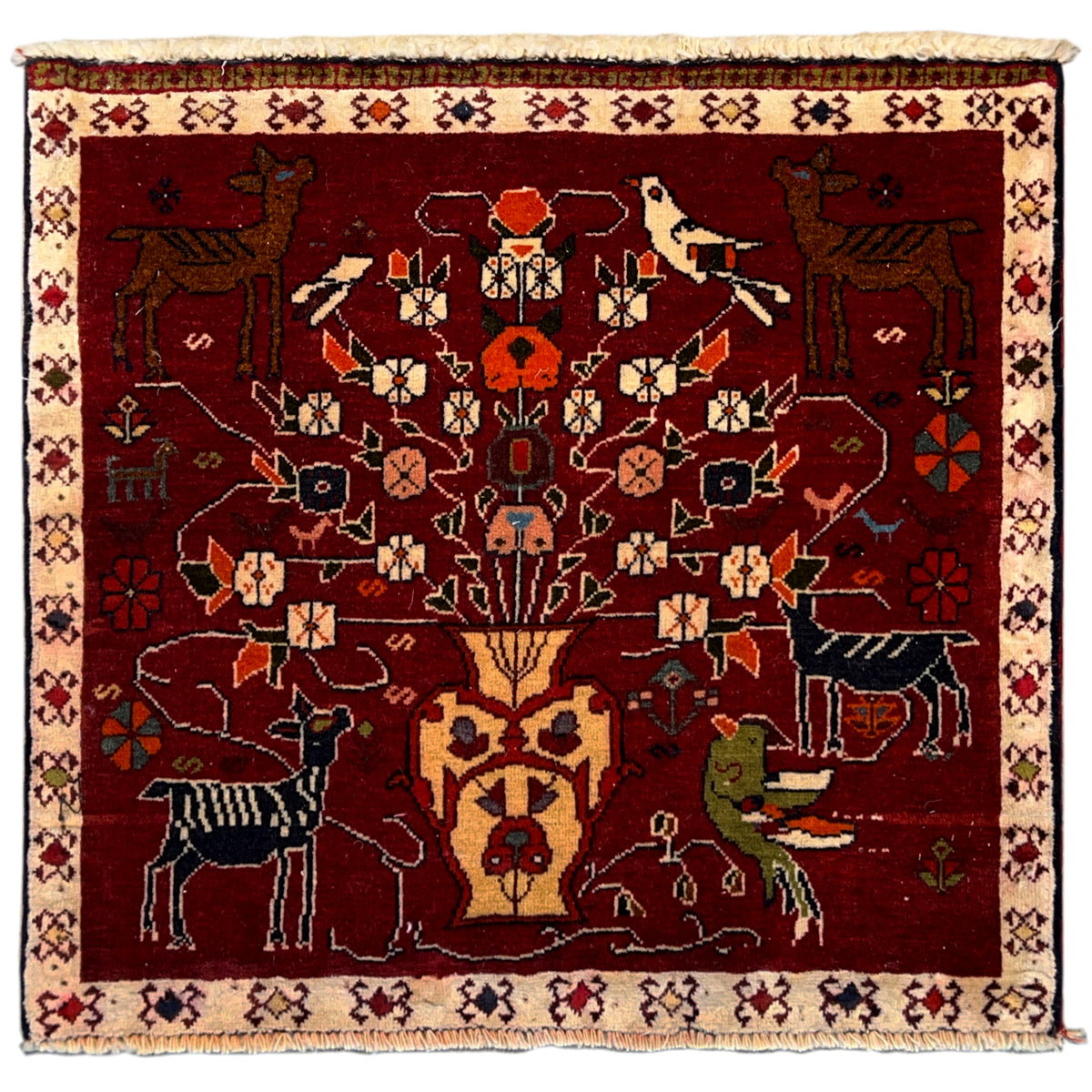 Red Poshti rug with medallion pattern and animal motifs, beige border, fringes