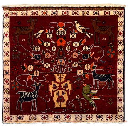 Red Poshti rug with medallion pattern and animal motifs, beige border, fringes