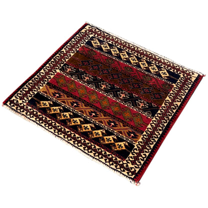 Rectangular Poshti rug with a multicolored zigzag and diamond pattern