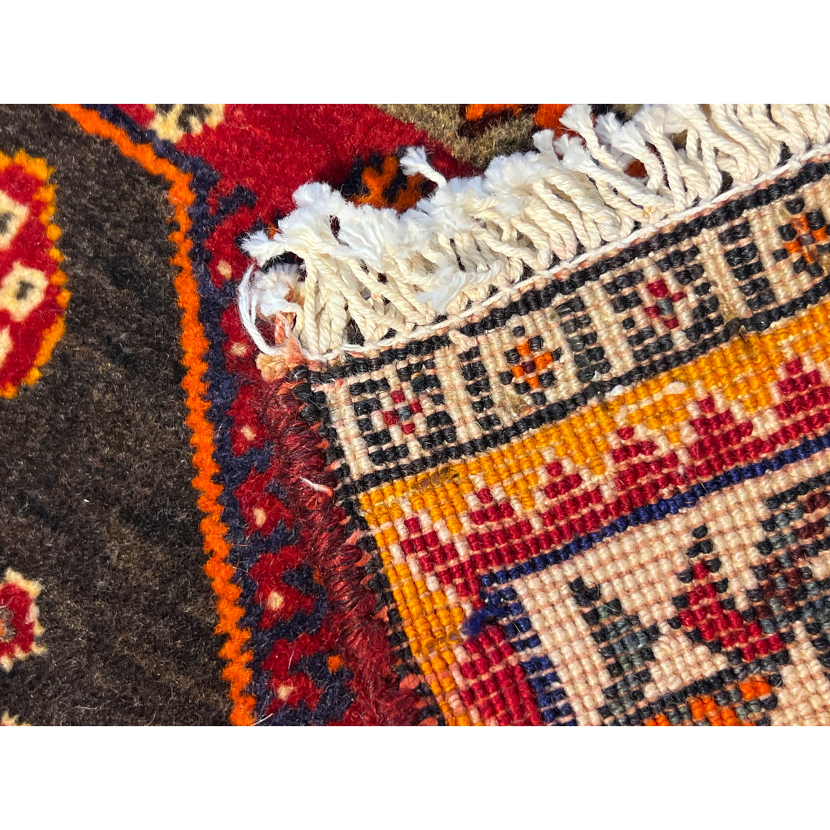 Poshti rug 65x60 cm with multicolored pattern and fringes, detail view
