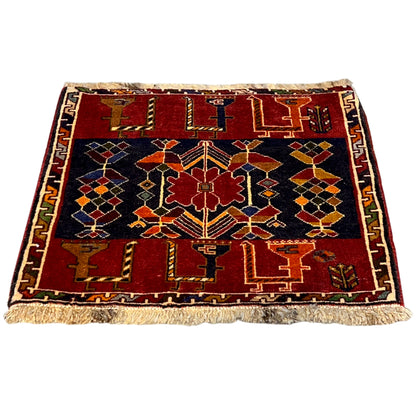 Poshti rug 51x50 cm with a geometric pattern in red, dark blue, and colorful accents