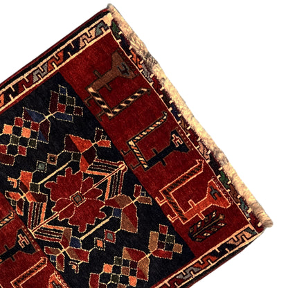 Poshti rug corner with fringes: red and dark blue pattern, multicolored decorative lines