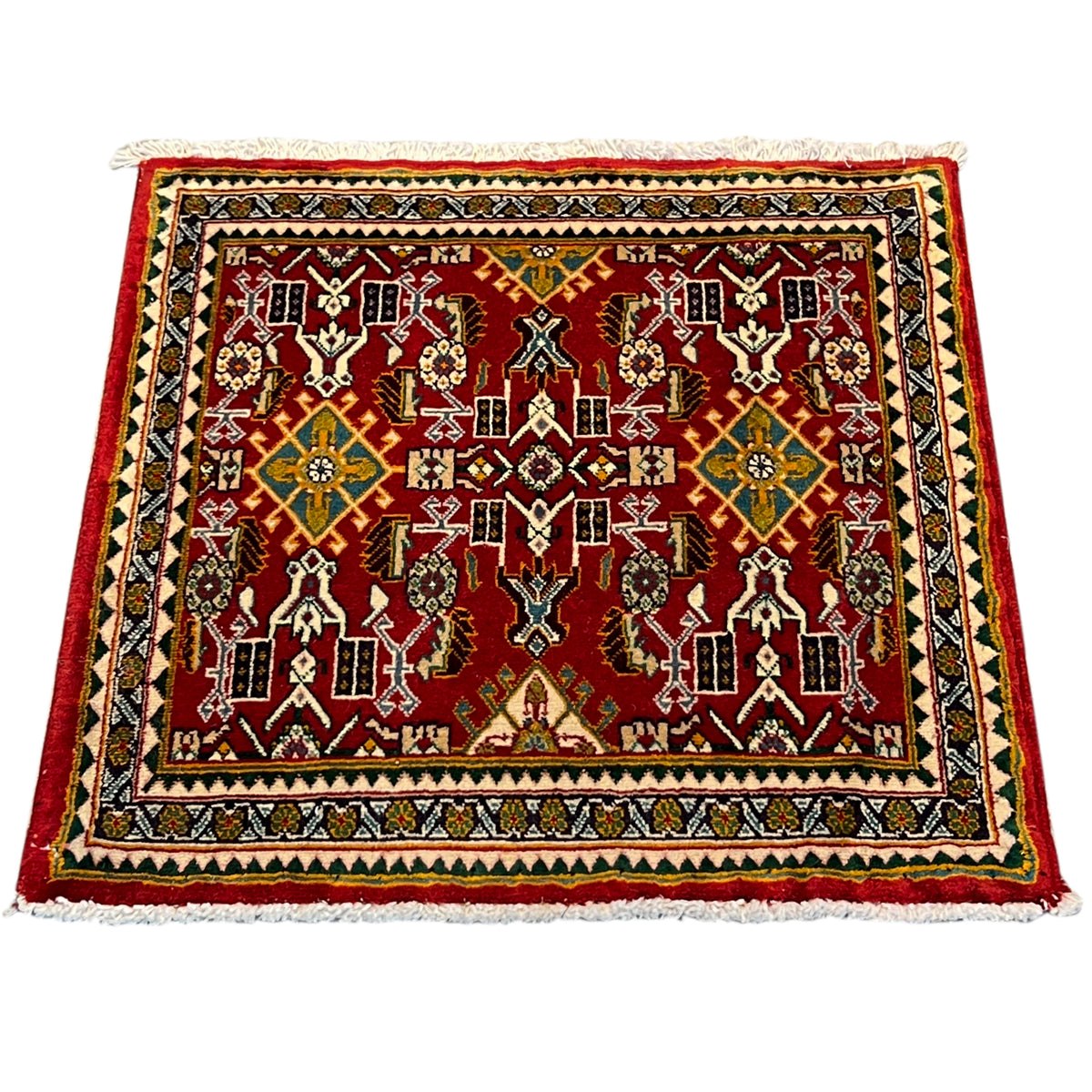 Carpet with a red ornamental pattern, multicolored border, square, fringes