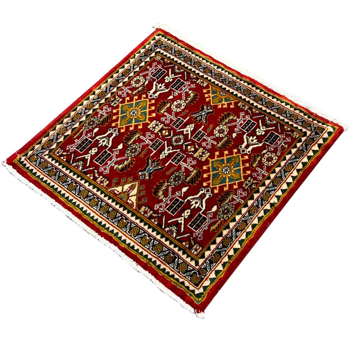 Rug with a red background and delicate ornaments, dark framed border