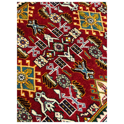 Detail of the carpet pattern: red area with geometric ornaments