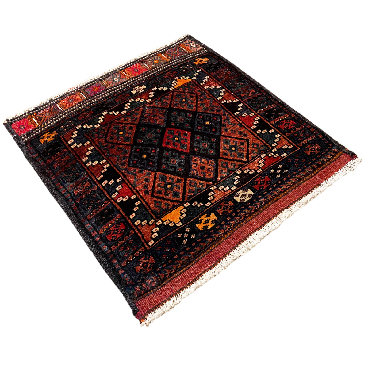 Hamedan Poshti rug from the side: geometric pattern in black, red and beige, with fringes