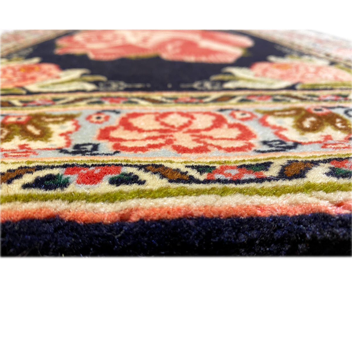 Hamedan Poshti rug, pile height detail: multicolored patterns and a dark background.