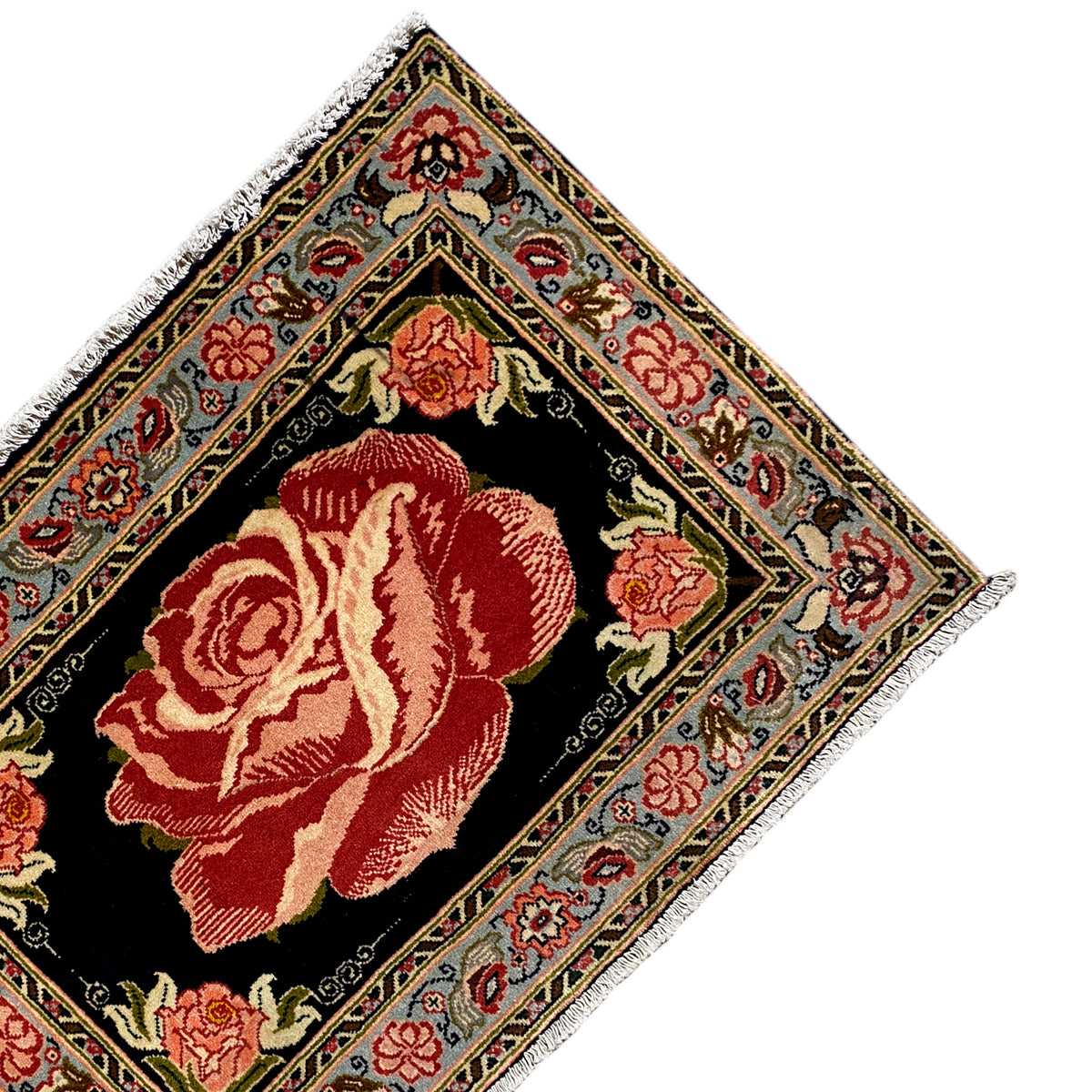 Hamedan Poshti carpet detail from above: black center with a red rose and decorative borders.