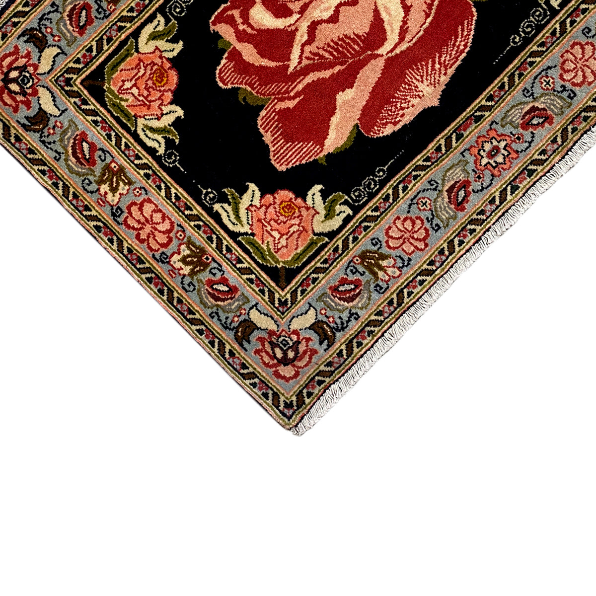 Hamedan Poshti carpet corner section: black field, red rose motifs, and ornamental borders.