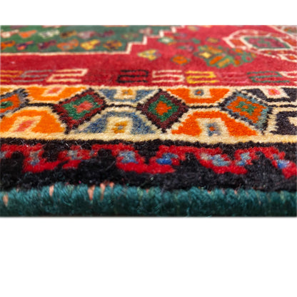 Close-up of a carpet edge: multicolored patterns with a dense, fluffy pile edge