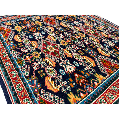 Carpet 61x60 cm close-up: dark pile with colorful floral and geometric patterns.