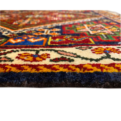 View Poshti rug 57x56 cm: pile and fringe along the edge, multicolored pattern