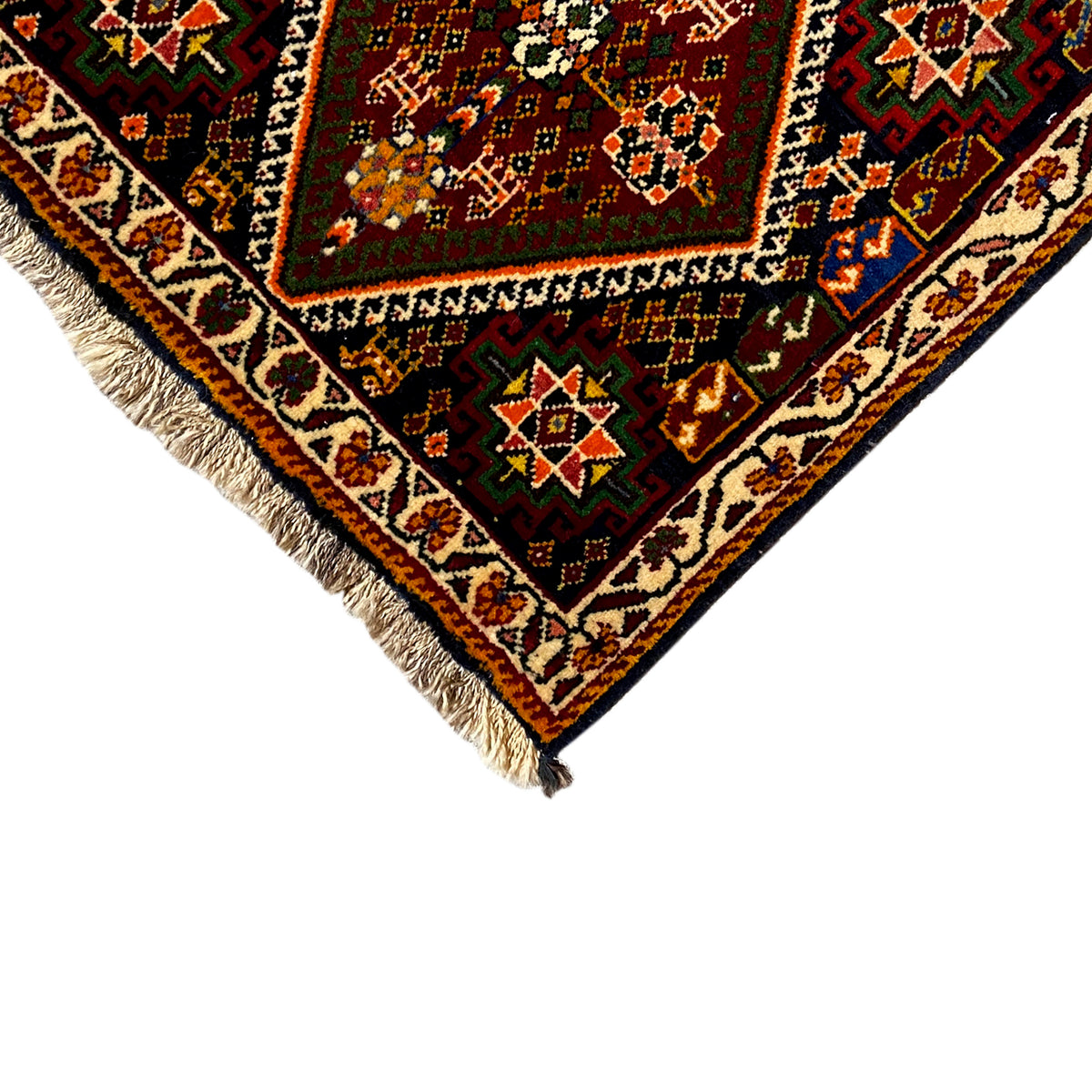 Detail of the Poshti rug, 57x56 cm: border pattern and fringes, multicolored ornamental field