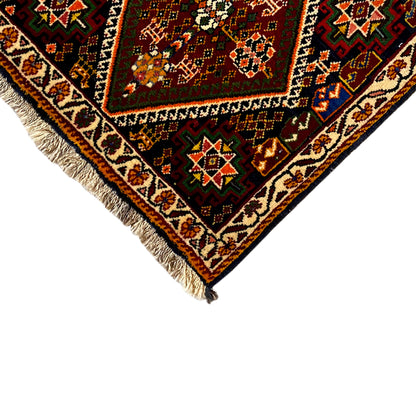 Detail of the Poshti rug, 57x56 cm: border pattern and fringes, multicolored ornamental field