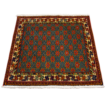 Rectangular rug with a blue background and multicolored star patterns, fringes