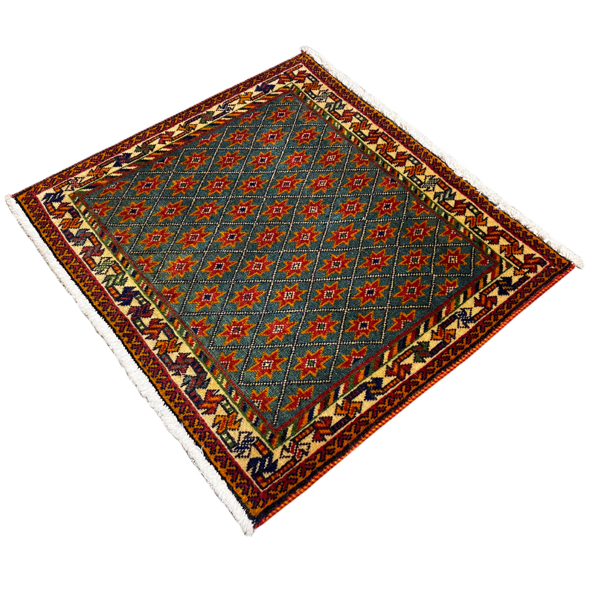 Rug with a blue pattern and colorful stars, bound edge, fringes, angled