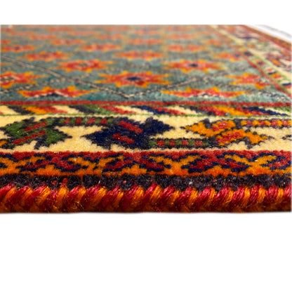 Rug edge with a dense pile and colorful stripes, side fringes