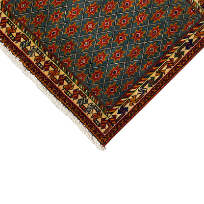 Corner with a blue star pattern and multicolored border, white fringes and trim