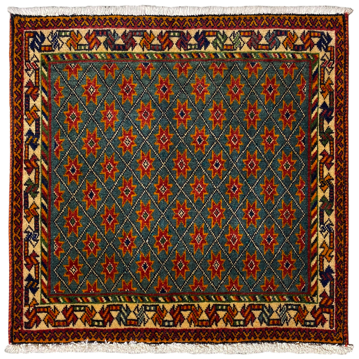 Rug with a blue pattern, red and green stars, rectangular, with fringes