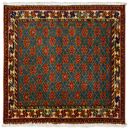 Rug with a blue pattern, red and green stars, rectangular, with fringes