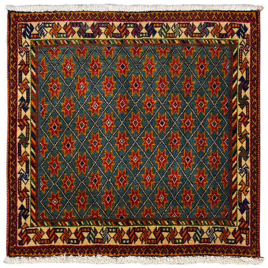 Rug with a blue pattern, red and green stars, rectangular, with fringes