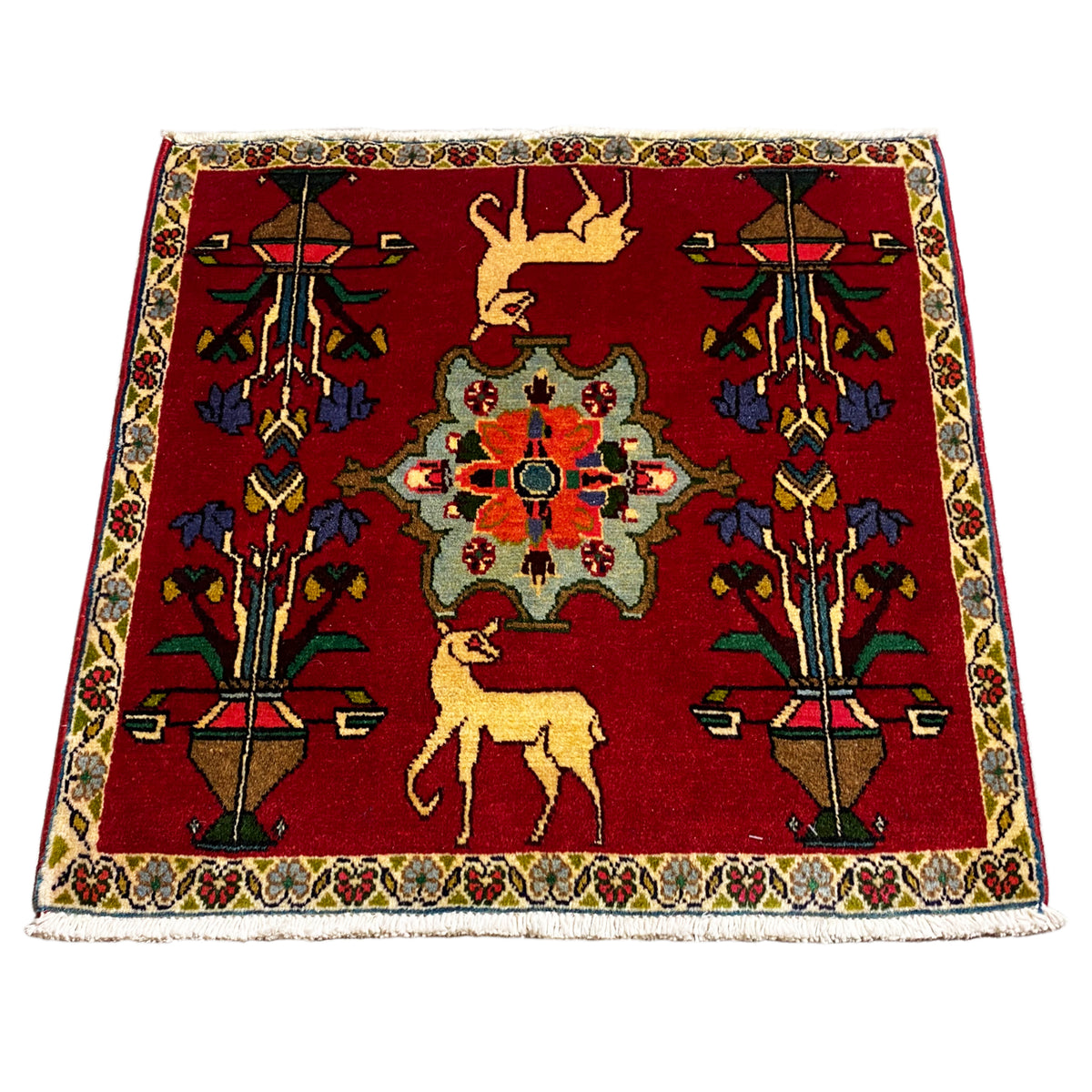 Poshti rug (67x64 cm) with a red ornamental pattern, central medallion design, and border.