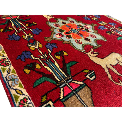 Poshti rug (67x64 cm) close-up: red design with ornaments and an animal figure.