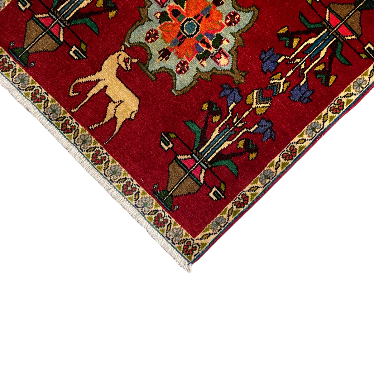 Poshti carpet (67x64 cm) corner detail: red pattern with border frieze and ornaments.