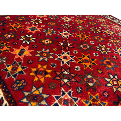 Poshti rug 59x56 cm, detail view: red geometric pattern with colorful motifs