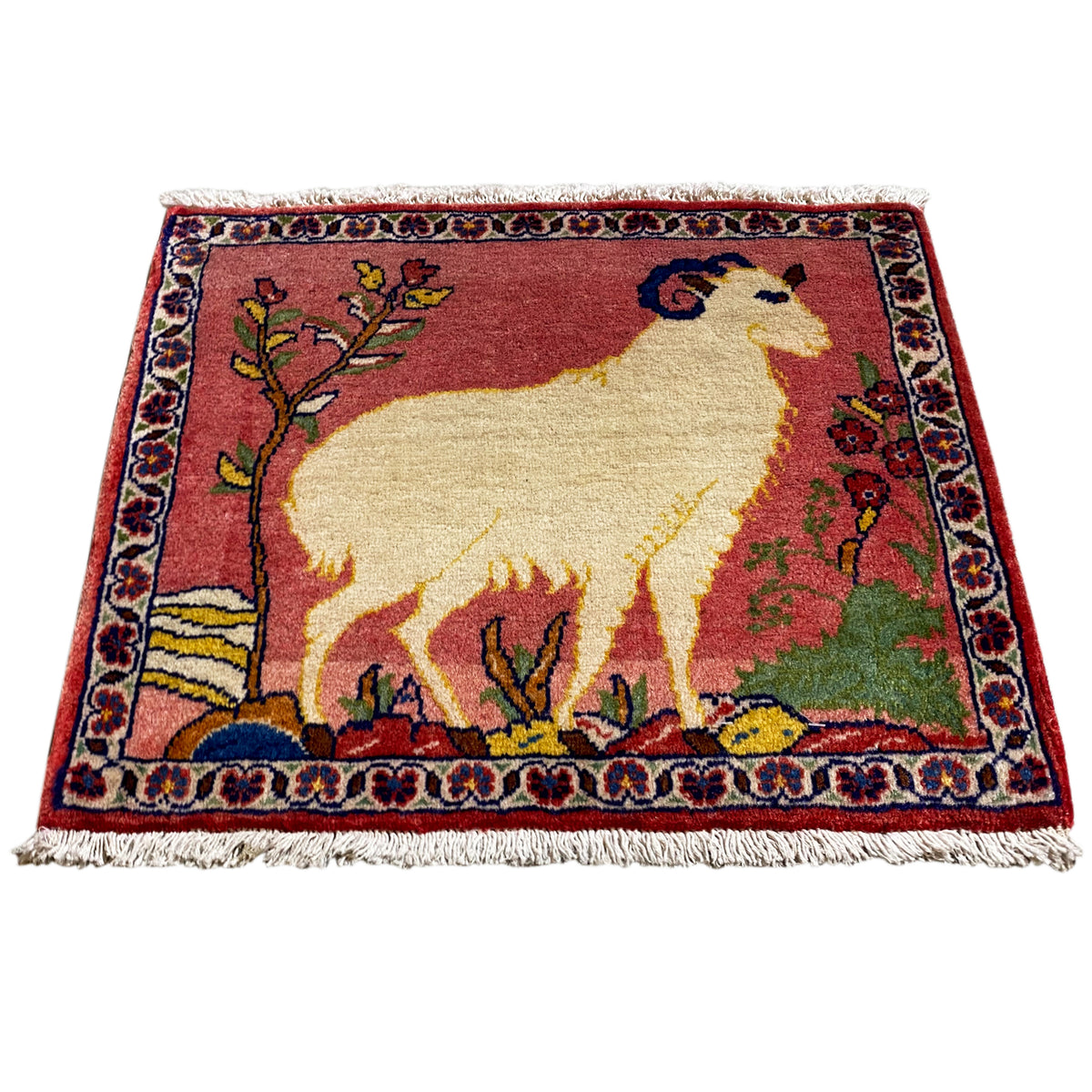 Rug 54x48 cm with fringes, red pattern with animal and floral border