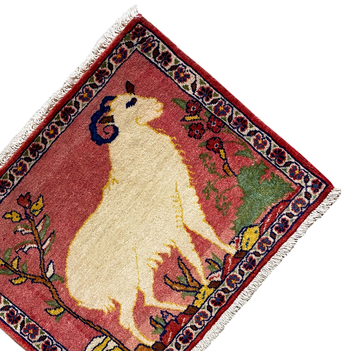 Square rug 54x48 cm with fringe, red pattern and animal motif at the top