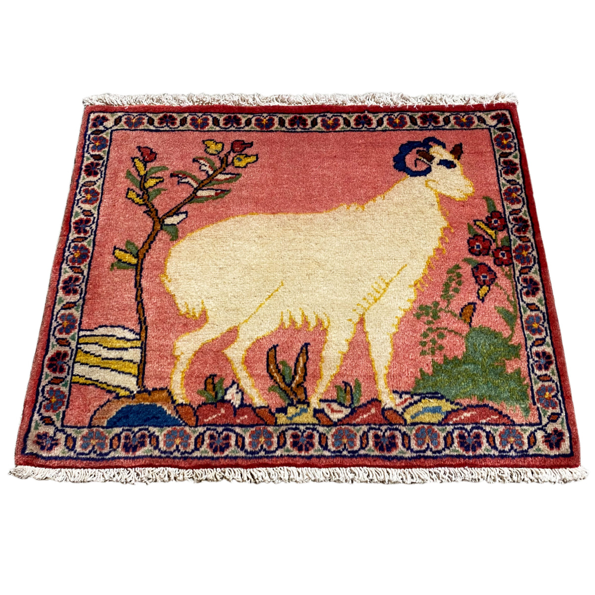 Small rug with an oriental pattern and lamb/animal motif, red, beige, fringes