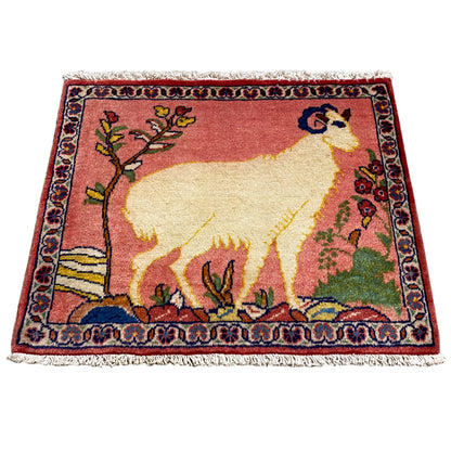 Small rug with an oriental pattern and lamb/animal motif, red, beige, fringes