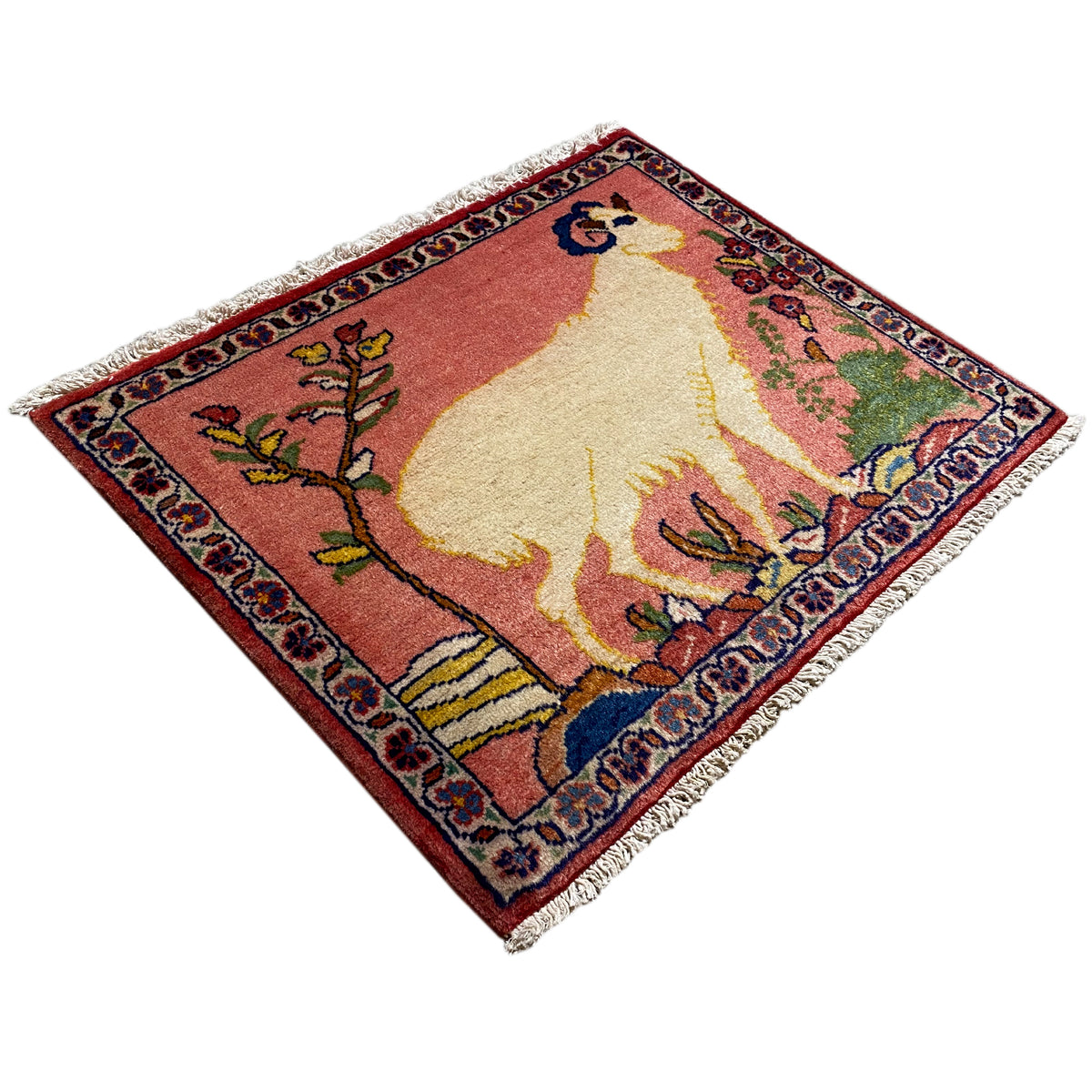 Landscape-oriented rug with an animal motif, red and beige, blue border, fringes along the edges