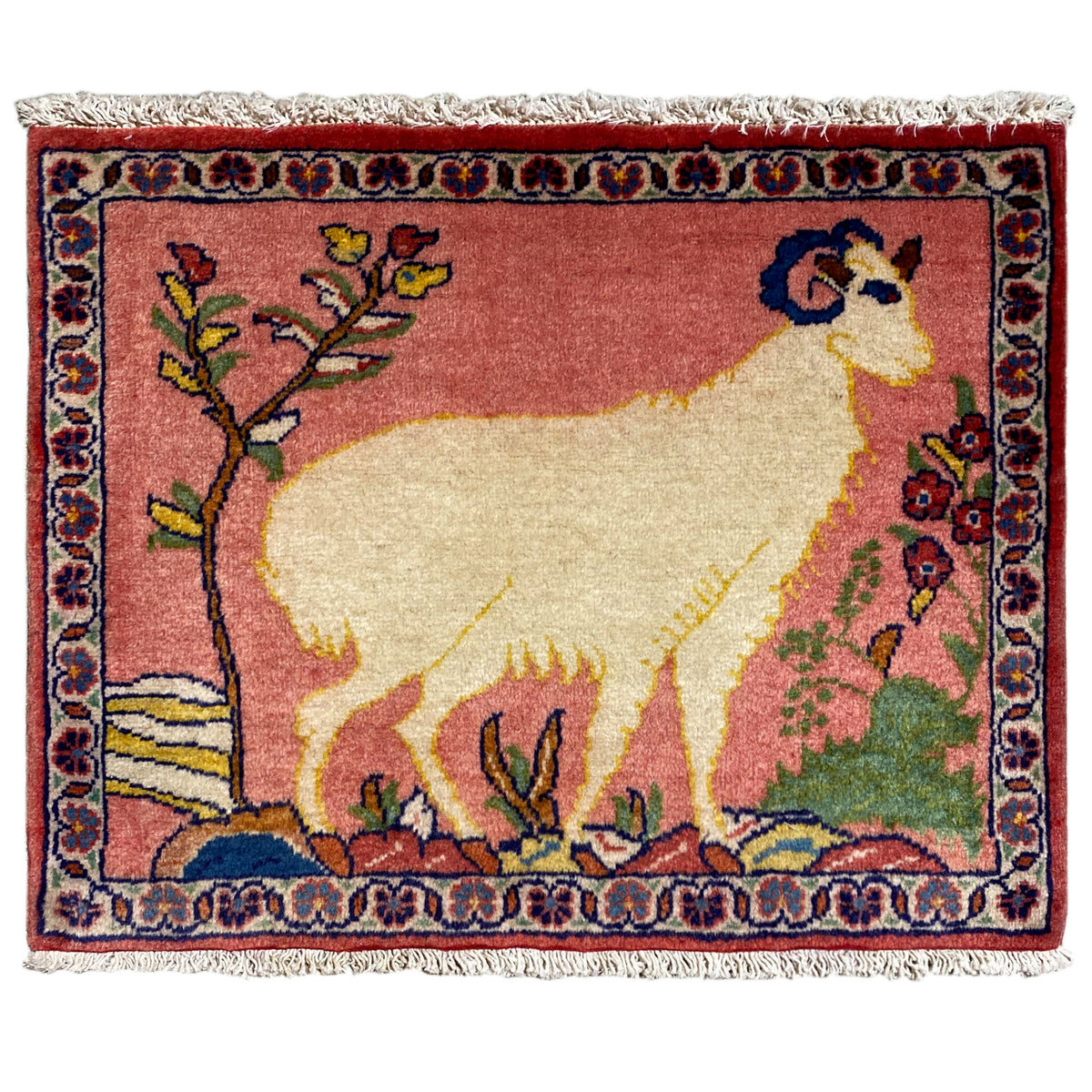 Rug with an animal motif in an oriental pattern, red and beige, framed with floral designs, with fringes