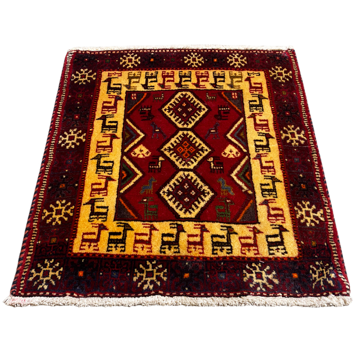 Burgundy-colored rug with a beige ornamental border and a central diamond pattern