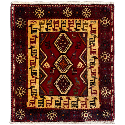 Square dark red rug with a beige patterned border and central diamonds