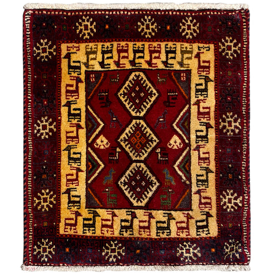 Square dark red rug with a beige patterned border and central diamonds