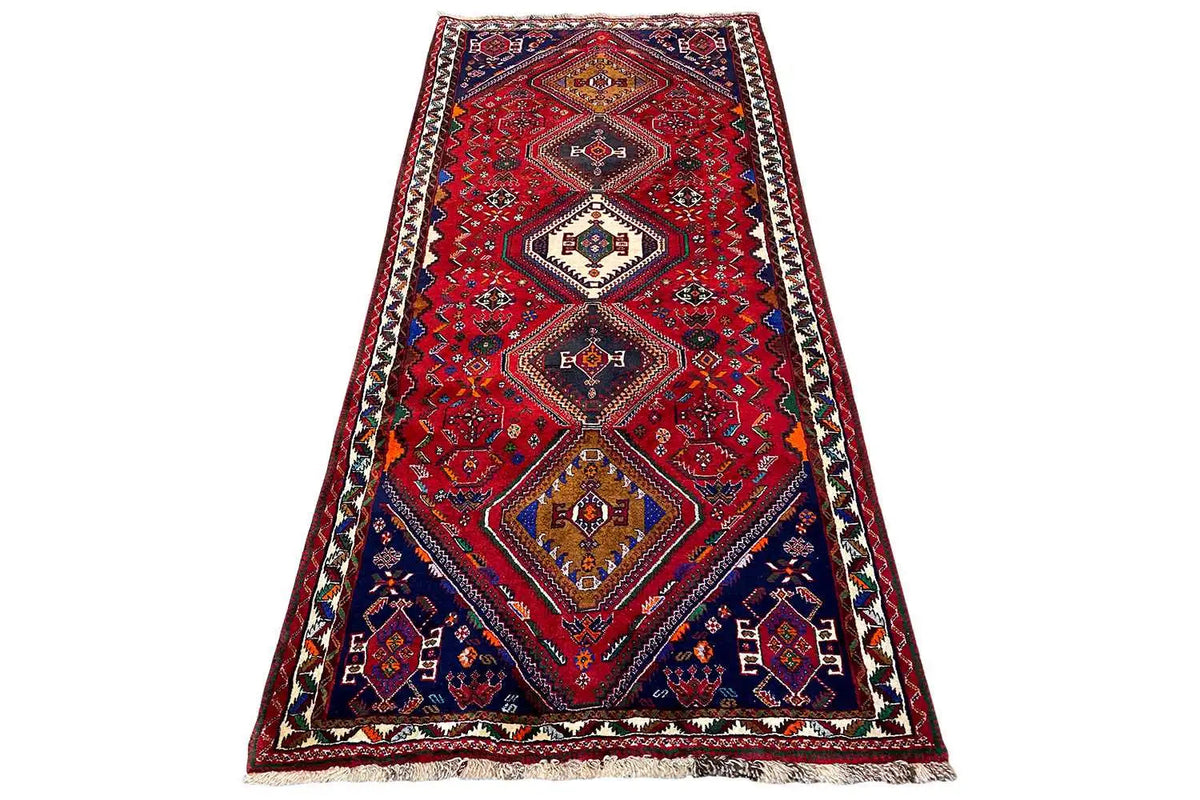 Qashqai runner with a red geometric pattern and border, approx. 259×116 cm