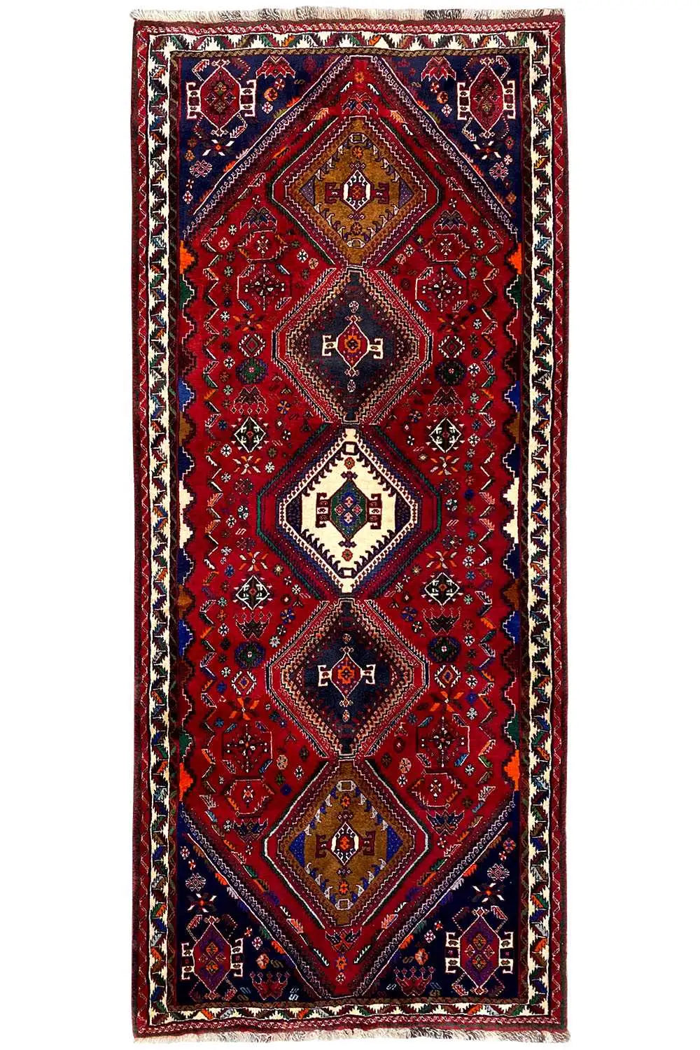 Rectangular Oriental rug runner: red central pattern with blue medallions, framed border edge