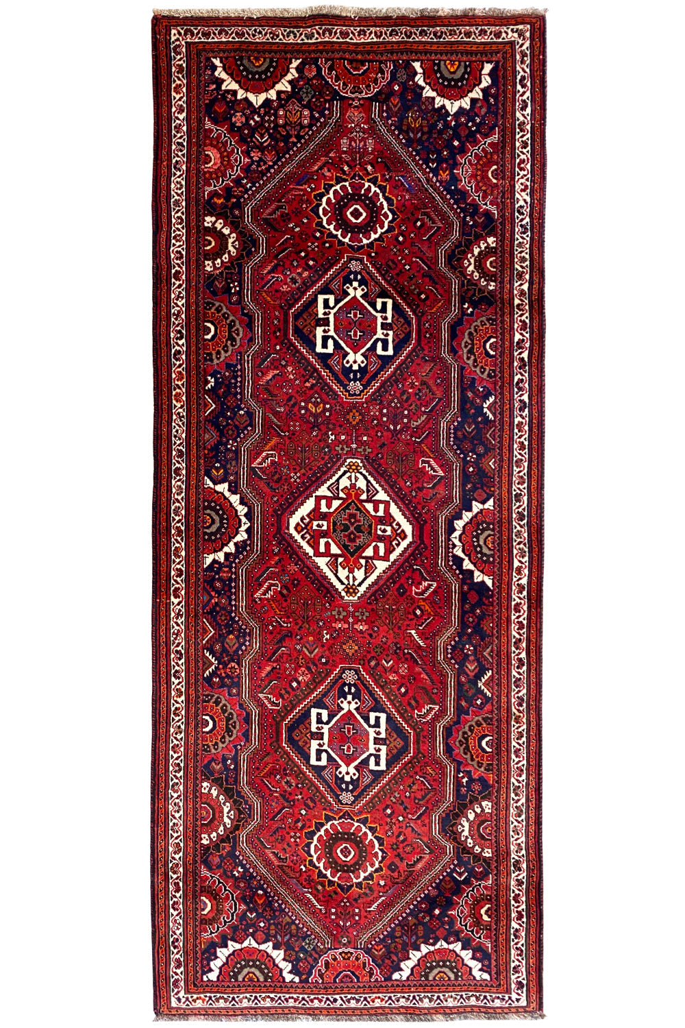 Oriental rug runner (297x115 cm) with a red ground, central diamonds, and dark blue borders
