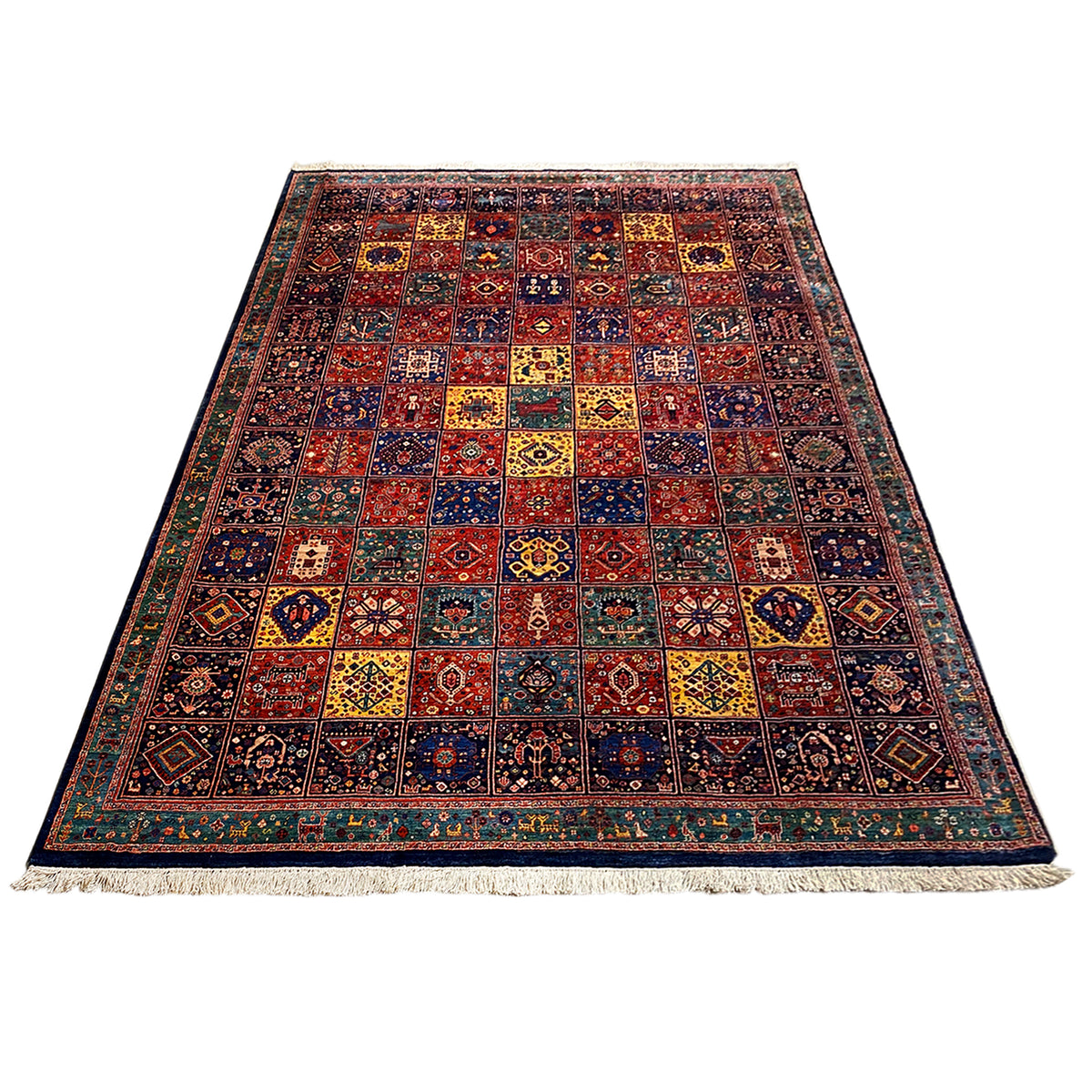 Rectangular Qashqai rug with a colorful pattern and fringe along the bottom edge
