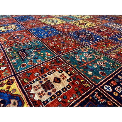 Detailed view: Qashqai rug, dense ornamental pattern in blue, red, yellow, and green